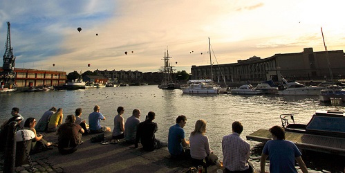 People enjoying the summer sunshine at the harbourside